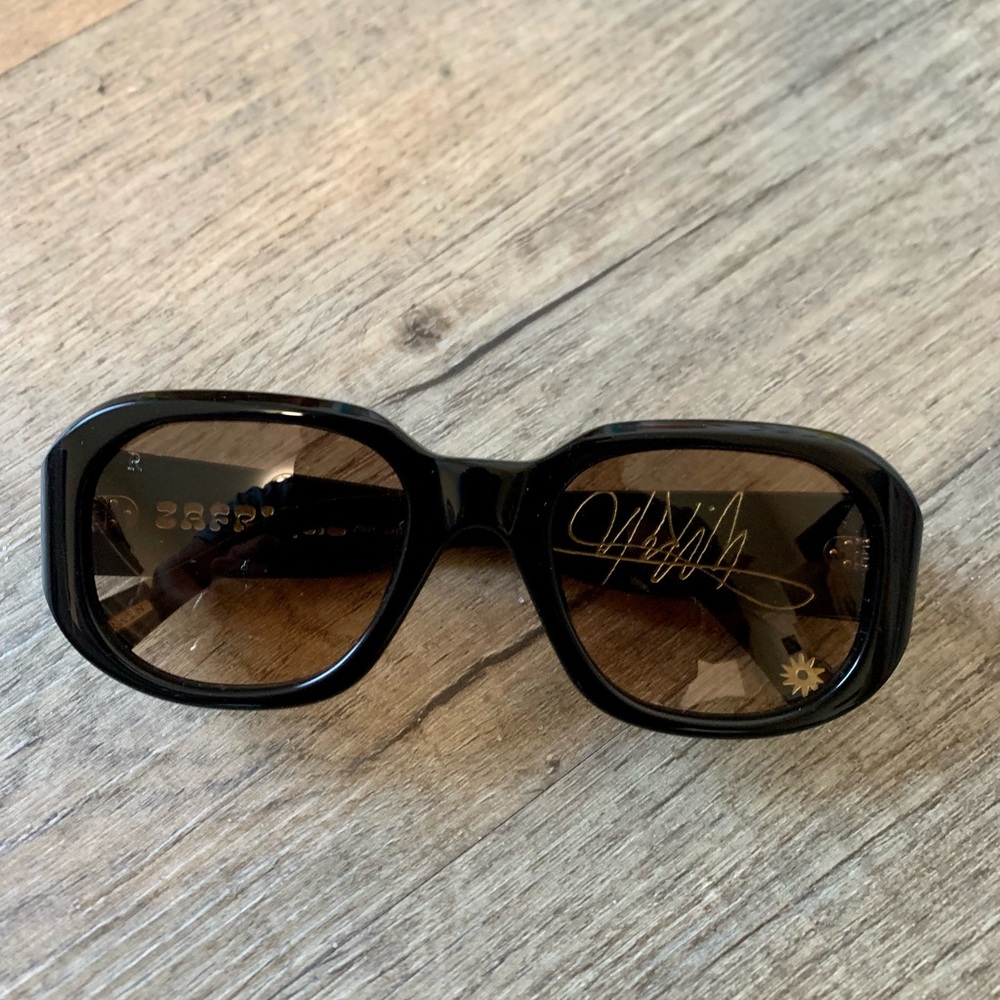 RAEN Women's Black Frame Sunglasses with Brown Lenses